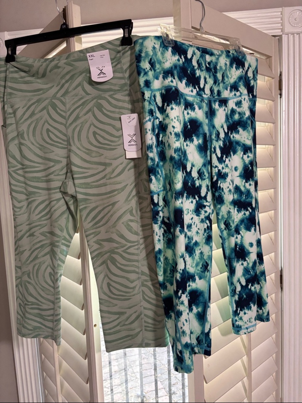 two pairs of athletic capris, size XXL